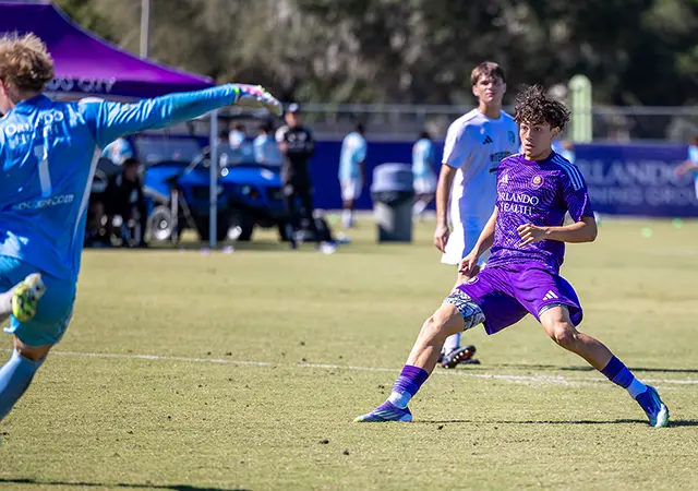 Jose Segura playing a MLS Next Match vs West Florida Flames running up to the goalie
